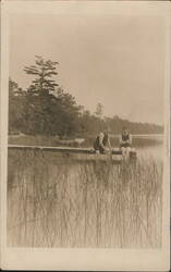 Two women in swimsuits on dock by lake, 1913 Postcard