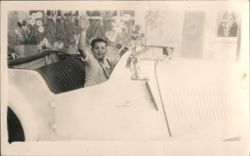 Boy Waving in Classic Car with Floral Backdrop Postcard