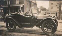 Young Woman in Early Touring Car, Residential Street Scene Postcard