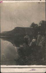 Man & Women Fishing by River, Hills in Background Postcard