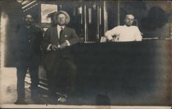 Three Men Posing Indoors Postcard