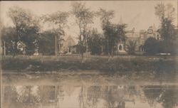 Building Reflected in Water, Dalhousie, NB Postcard