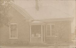 Brick Home with Family on Porch, 1911 Postcard