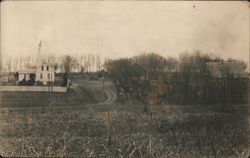 Farmstead with House, Barn, Windmill, and Trees Postcard