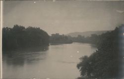 River with Lush Banks and Distant Hills Postcard