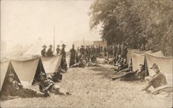 Soldiers Relaxing in Military Camp with Tents Postcard