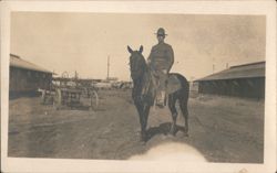 Soldier on Horseback at Military Camp with Barracks Postcard