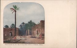 Sahara Desert Edge Town with Palm Trees & People Postcard
