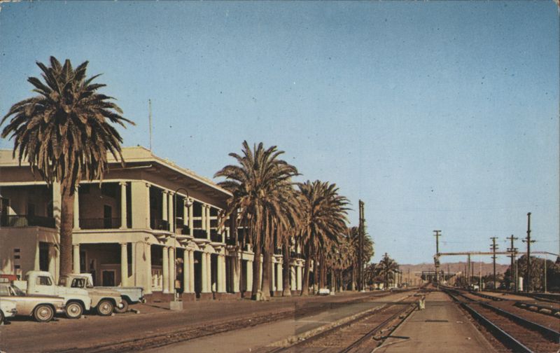 Needles Rail Road Depot, Palm Trees, Trucks, CA California