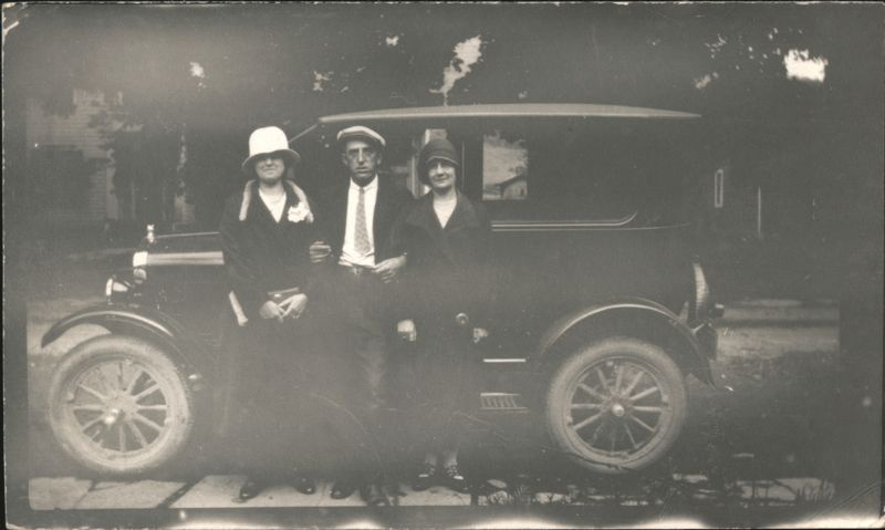 Man and Two Women Posed with 1920s Sedan Automobile