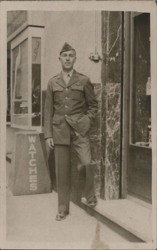 WWII US Army Soldier Outside Optician Shop with Watches Sign