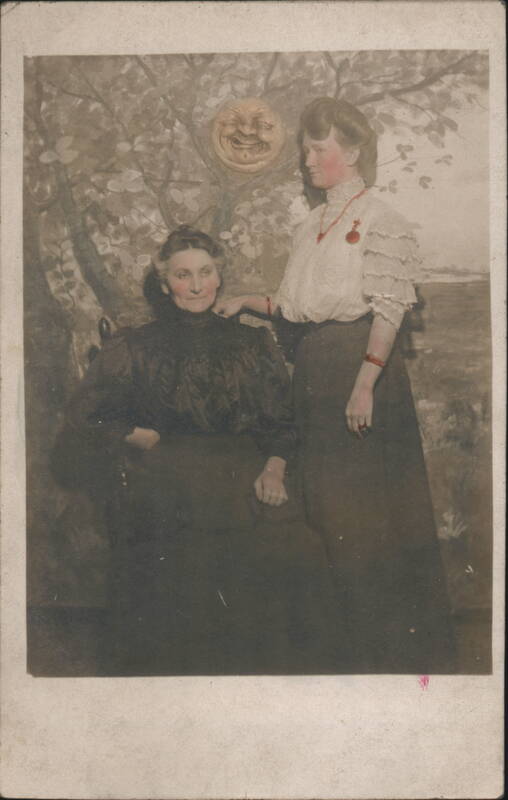 Studio Portrait Two Women Man in the Moon Backdrop
