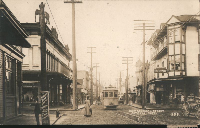Commercial Street Scene with Streetcar & Stores Astoria Oregon