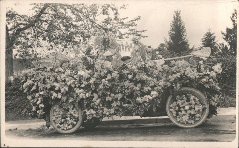 Decorated Automobile Floral Parade Float with Passengers