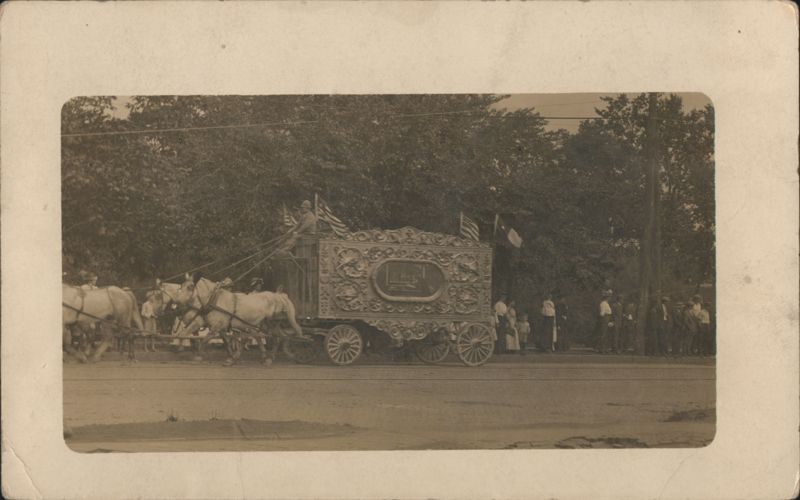 Ornate Circus Wagon Drawn by White Horses in Street Parade