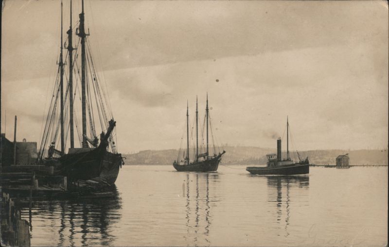 Three-Masted Schooners and Steam Tugboat in Harbor