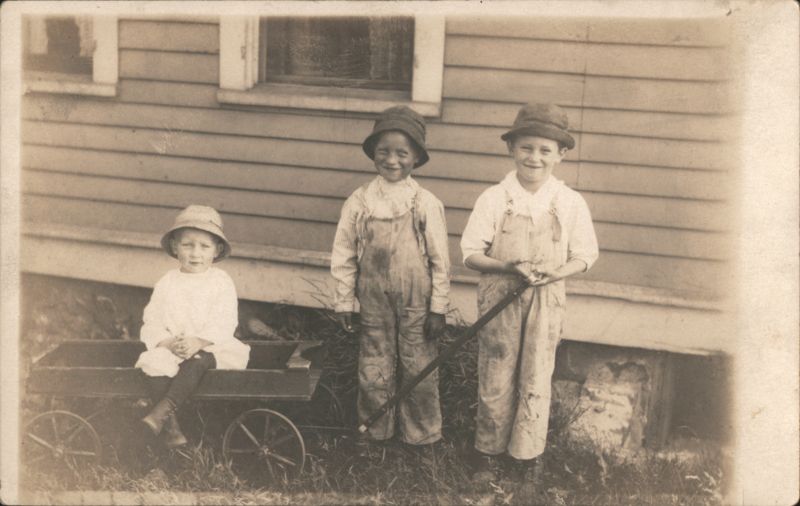 Three Children with Toy Wagon, Boys in Overalls