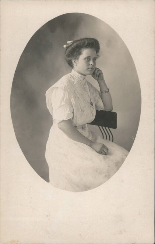 Studio Portrait Young Woman Profile, White Dress, Updo