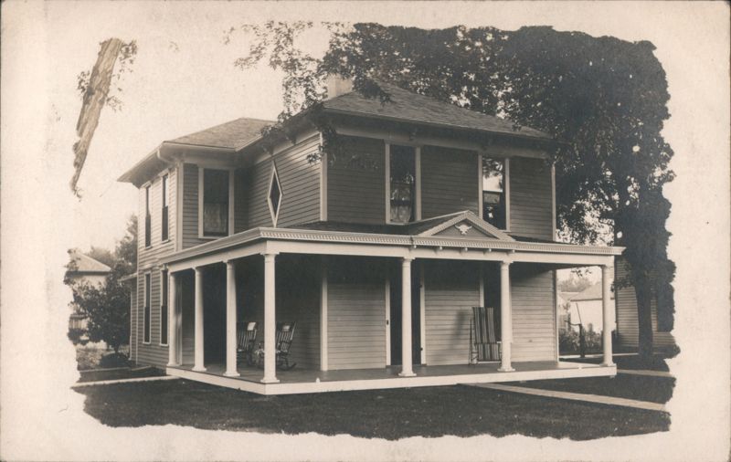 Two-Story House with Wrap-Around Porch & Rocking Chairs Clarinda Iowa