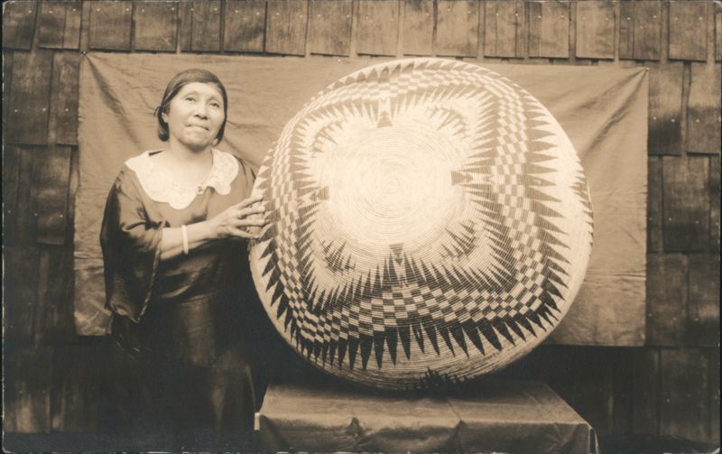 Native American Woman Standing by Large Woven Basket