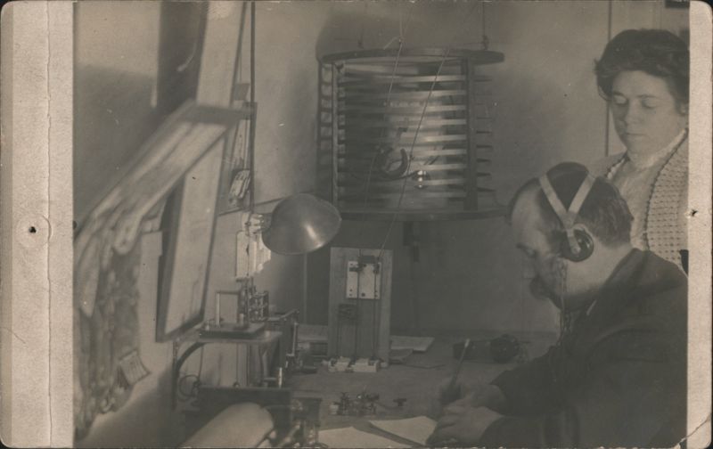 Early Amateur Radio Station Operator with Headphones & Woman
