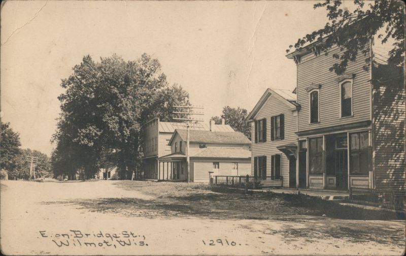 East on Bridge Street, Dirt Road and Storefronts Wilmot Wisconsin