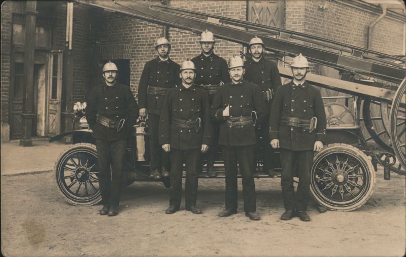 Seven Uniformed Firefighters with Antique Ladder Truck