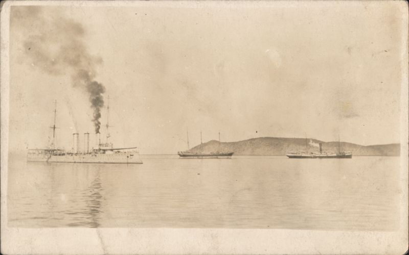 Naval Cruiser Warship and Steamers off Hilly Coast