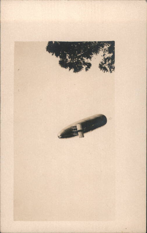 Early Dirigible Airship Flying Overhead Airships