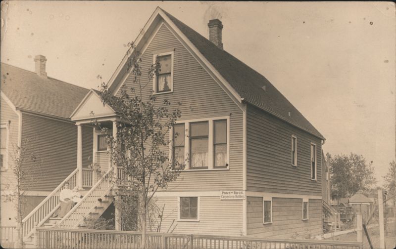 Pomey Bros. Carpenters & Builders House, Family on Steps