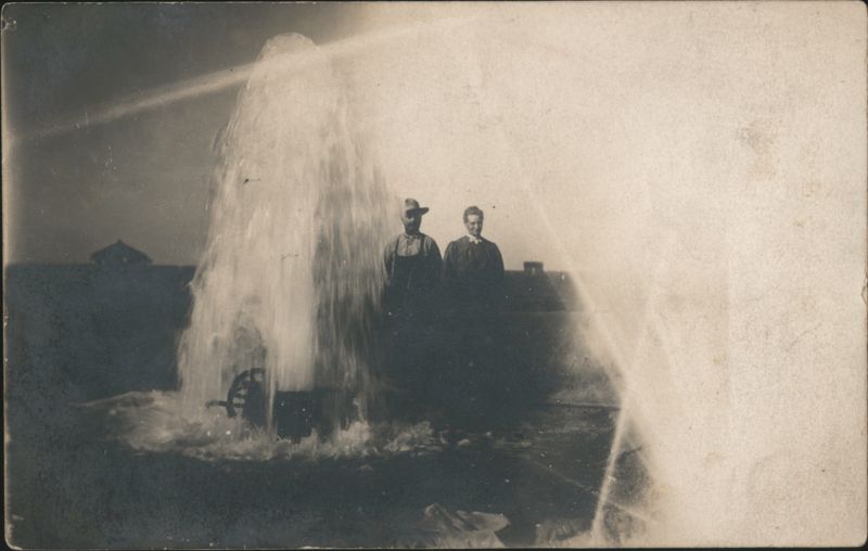 Gushing Artesian Well with Man & Woman, 886 Ft Deep, 1909 $4000