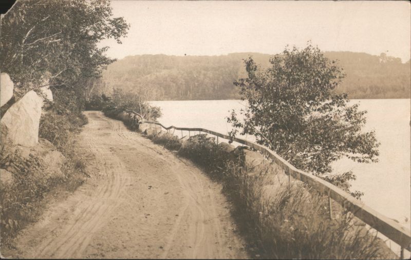 Dirt Road Along Lake Shoreline with Wooden Railing Camden Maine