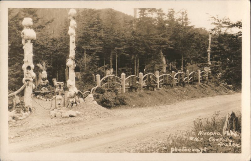 Nirvana Park Entrance, Carved Poles & Rustic Fence #162 Cordova Alaska