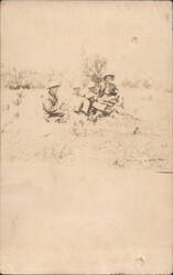 Group of Five Men Seated in Grassy Field Wearing Hats Postcard