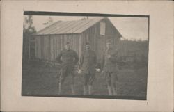 Three WWI US Soldiers Outside Wooden Barracks Postcard