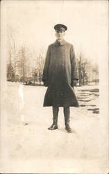 WWI Soldier in Winter Greatcoat Standing in Snow Postcard
