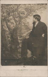Studio Portrait Man Seated with Smiling Moon Face in Tree Postcard
