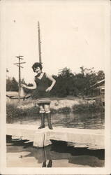 Beulah in 1920s Swimsuit Holding Megaphone on Concrete Wall Postcard