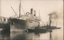 SS Regina Steamship Docked at Pier with Tugboats Postcard