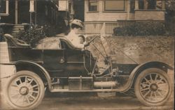 Woman Driving Brass Era Automobile with Child 1910 Postcard