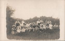 Large Group Picnic Eating Watermelon in Field Postcard