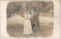 Edwardian Couple Standing Under Fruit Tree Outdoors Postcard