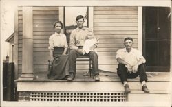 Family Group on Porch, Man with Pipe Holding Baby Postcard