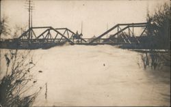 Steel Truss Bridge Over Turbulent River with Horse Rider Postcard