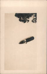 Early Dirigible Airship Flying Overhead Postcard