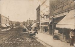 View on Main St. Showing Post Office and Storefronts Postcard