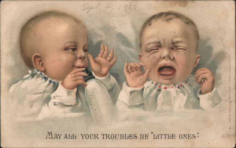 Crying and Smiling Babies with 'May All Your Troubles Be Little Ones' Saying
