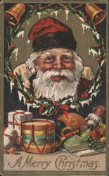 Santa Claus with Holly Wreath, Bells, and Christmas Toys Postcard