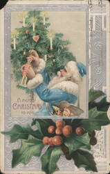 Santa Claus in Blue Suit with Christmas Tree and Toys, Holly Border Postcard