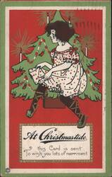 Girl in Polka Dot Dress by Christmas Tree, At Christmastide Postcard